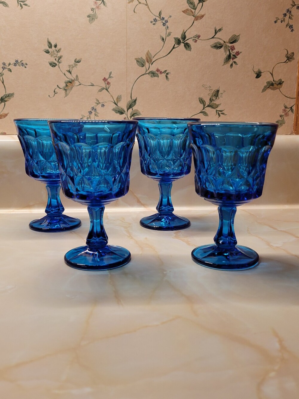 Vtg Noritake Perspective Saphire Blue glass goblets with a diamond-cut pattern